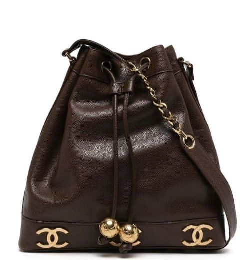 This is a Chanel Pre-owned 1990s Triple CC Leather Bucket Bag in brown.